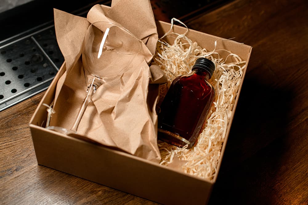 A bottle in a box for shipping alcohol